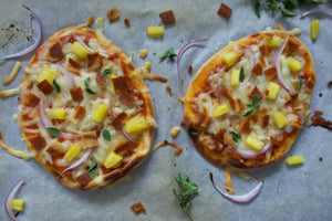 NATURE'S CHOICE MINI PIZZAS Quick and simple mini pizzas! Vegan naan bread, marinara sauce, vegan cheese, lots of Nature's Choice plant-based strips and pineapple chunks.