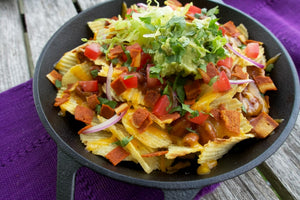 NATURE'S CHOICE LOADED POTATO CHIP NACHOS Potato chips topped with vegan chili, vegan cheese, chopped tomatoes, shredded lettuce, sliced onions, guacamole, Nature's Choice bacon strips, and cilantro. 